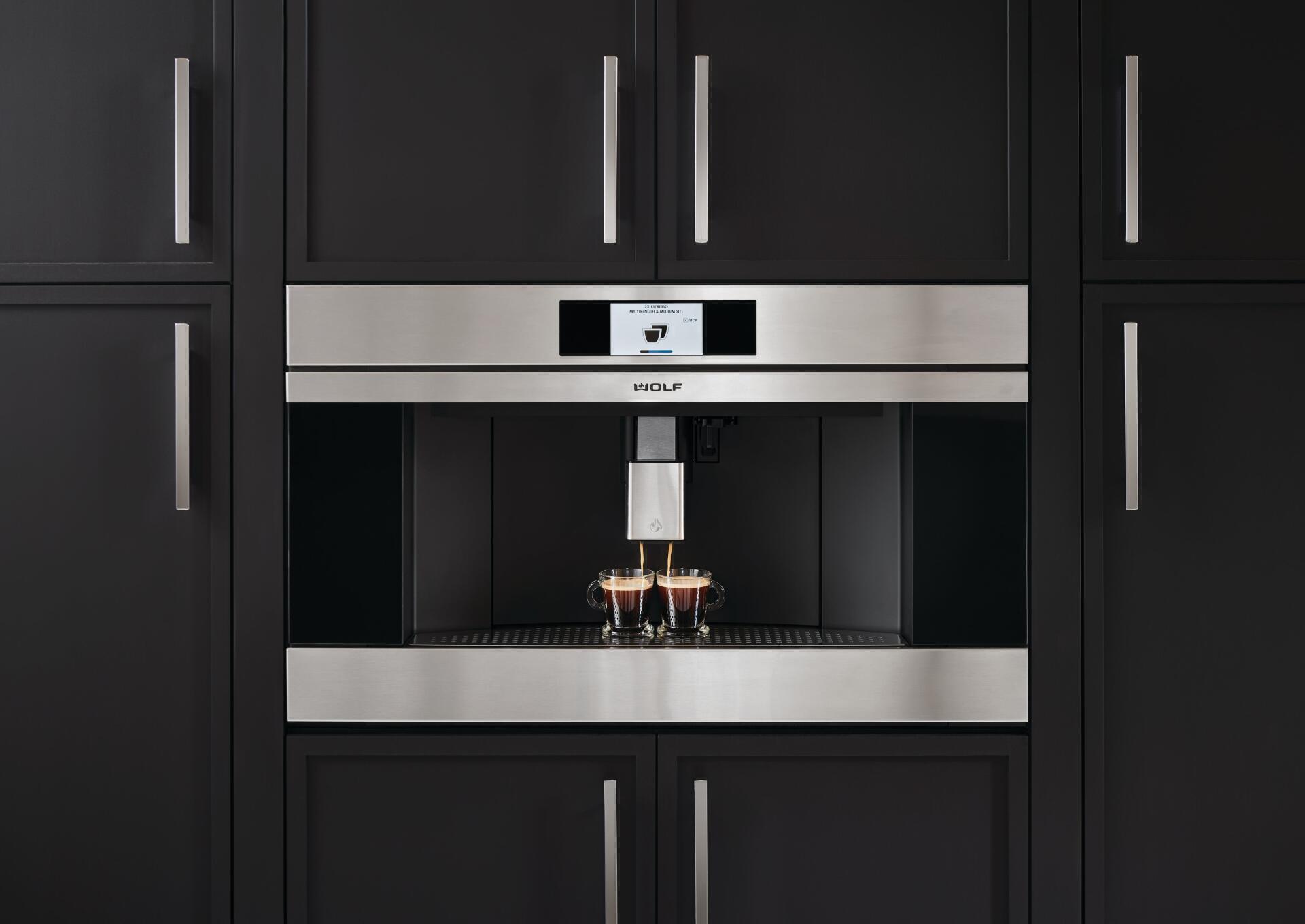 sleek black coffee machine making 2 expressos at once