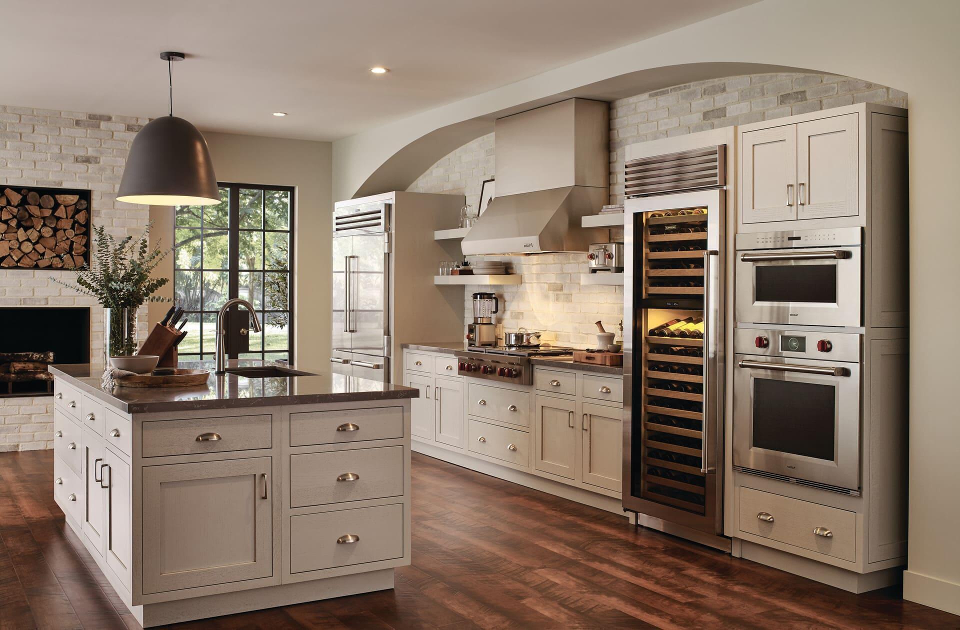 classic white home design with wine storage and ovens